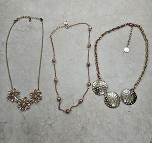 Ornate Silver and Rose Gold Necklace Trio with Intricate Pendants